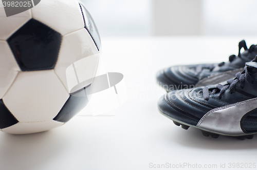 Image of close up of soccer ball and football boots