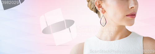 Image of close up of beautiful woman face with earring