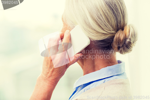 Image of close up of senior woman calling on smartphone