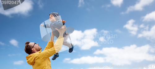 Image of father with son playing and having fun outdoors