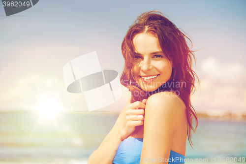 Image of woman in bikini smiling