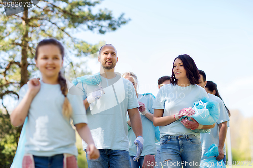 Image of group of volunteers with garbage bags in park