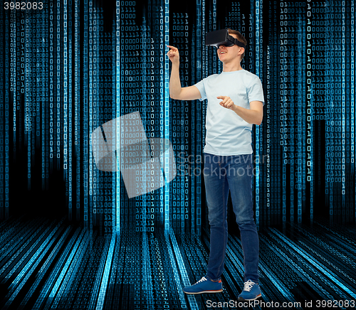 Image of happy man in virtual reality headset or 3d glasses