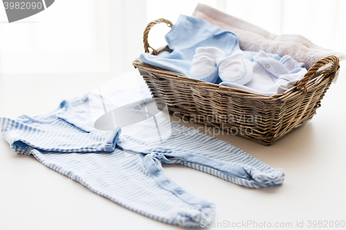 Image of close up of baby clothes for newborn boy in basket