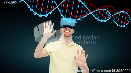 Image of happy man in virtual reality headset or 3d glasses