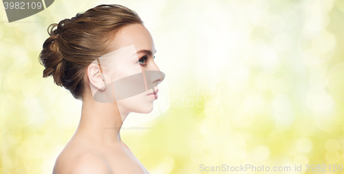 Image of beautiful young woman face over white background