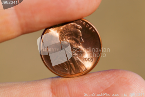 Image of coin in hand  