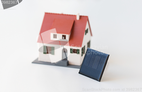 Image of close up of house model and solar battery or cell
