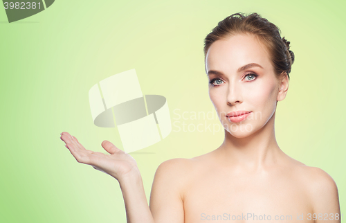 Image of smiling young woman face and shoulders