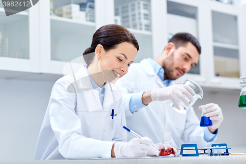 Image of young scientists making test or research in lab