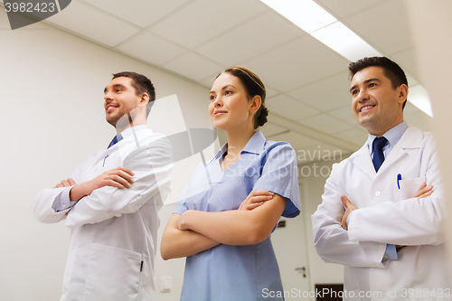 Image of group of happy medics or doctors at hospital