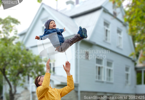 Image of father with son playing and having fun outdoors