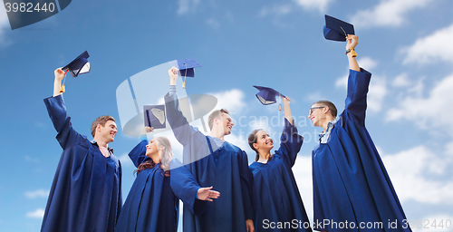 Image of group of smiling students with mortarboards