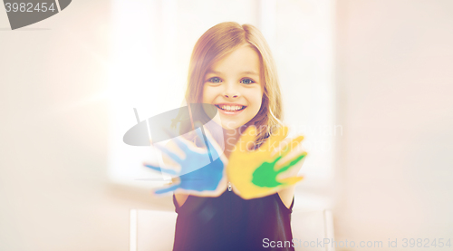 Image of girl showing painted hands