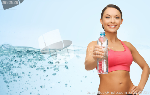 Image of sporty woman with bottle of water