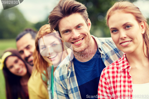 Image of group of smiling friends outdoors