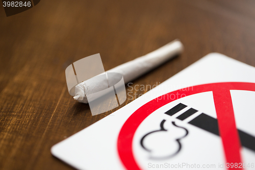 Image of close up of marijuana joint or handmade cigarette