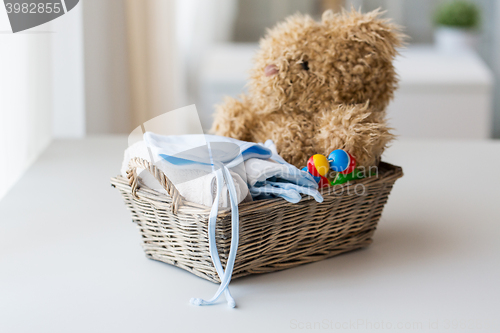 Image of close up of baby clothes and toys for newborn