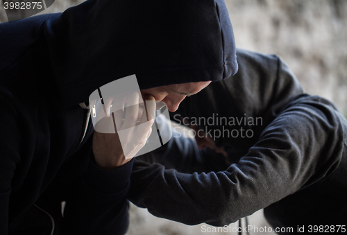 Image of close up of addicts on street