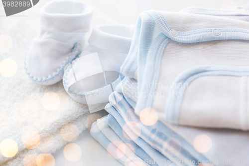 Image of close up of baby boys clothes for newborn on table