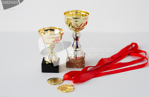 Image of close up of sports golden cups and medals