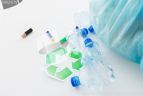 Image of close up of used bottles and batteries recycling