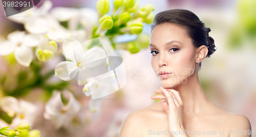 Image of face of beautiful asian woman with golden ring