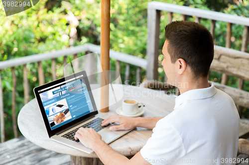 Image of close up of businessman with laptop on terrace