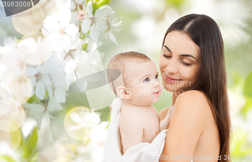 Image of happy mother holding adorable baby