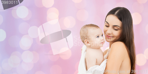 Image of happy mother holding adorable baby