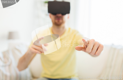 Image of young man in virtual reality headset or 3d glasses