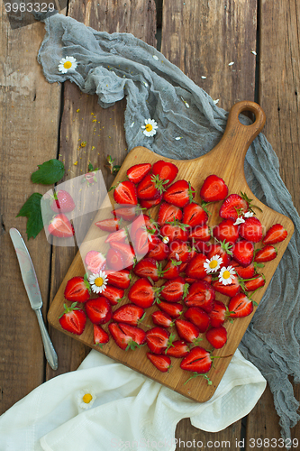 Image of Fresh strawberry fruits, flowers, leaves on white wood table background