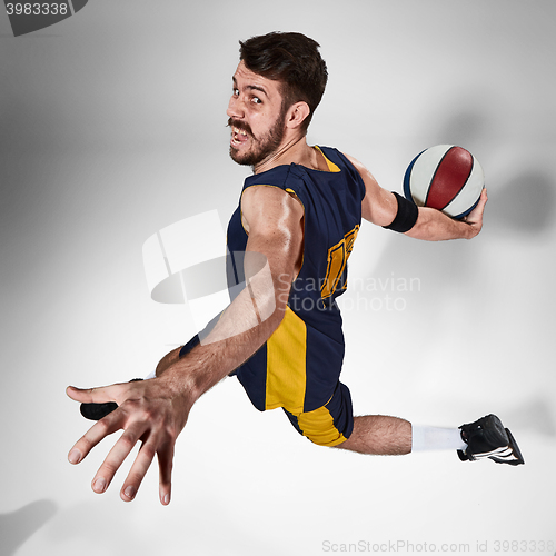 Image of Full length portrait of a basketball player with ball