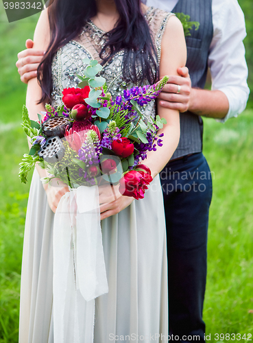 Image of The crop image of romantic couple with flowers