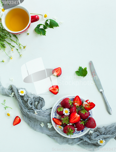 Image of Fresh strawberry fruits, flowers, leaves on white wood table background