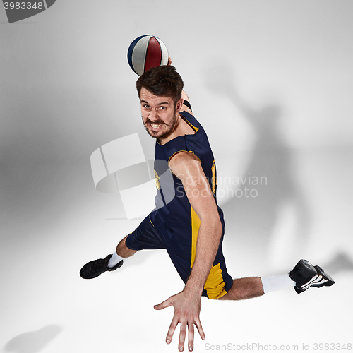 Image of Full length portrait of a basketball player with ball