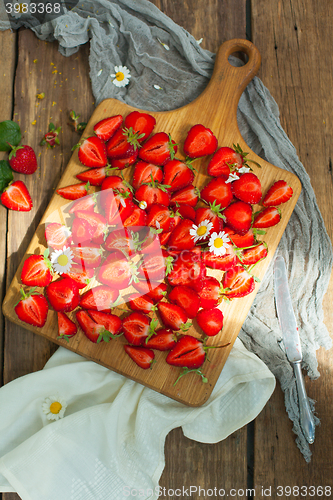 Image of Fresh strawberry fruits, flowers, leaves on white wood table background