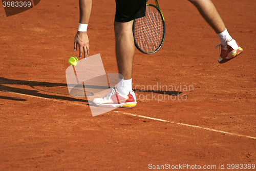 Image of Tennis player preparing for service