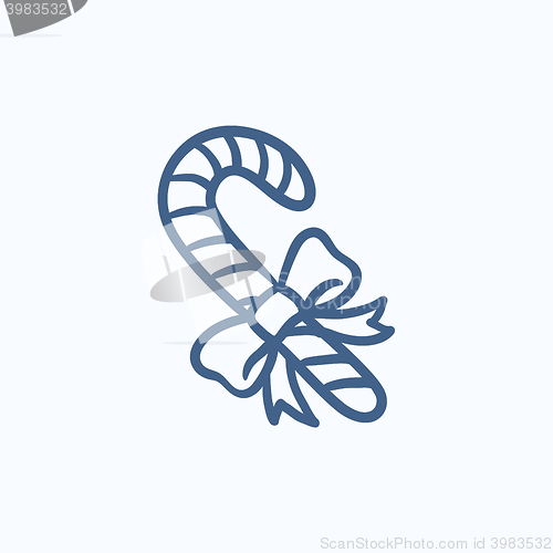 Image of Candy cane with christmas decoration sketch icon.