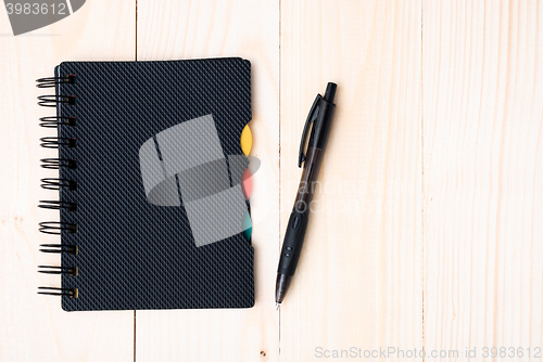 Image of notepad with pen isolated