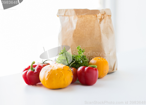 Image of close up of paper bag with vegetables at kitchen