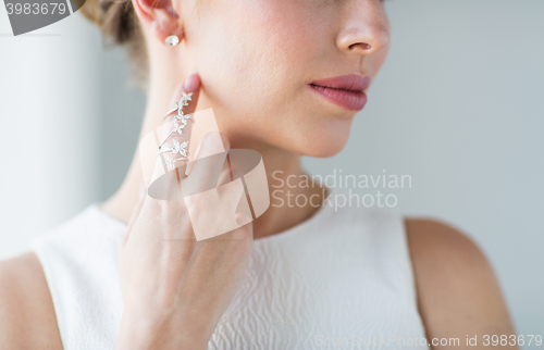 Image of close up of beautiful woman with ring and earring