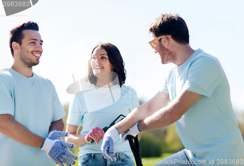 Image of group of volunteers planting tree in park