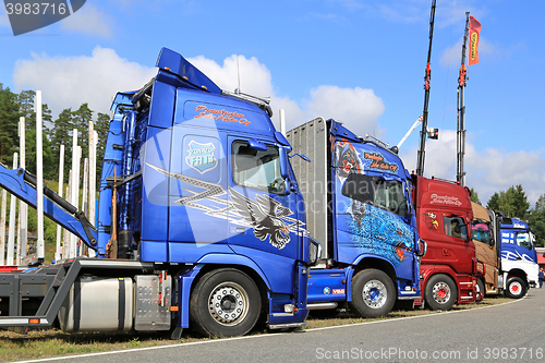 Image of Side View of Colorful Show Trucks 