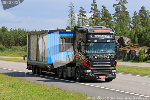 Image of Scania R500 Transports Portable Cabin Along Motorway