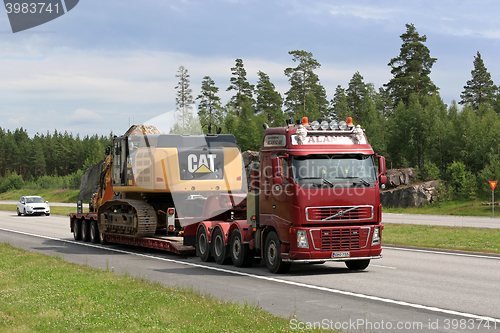 Image of Volvo FH Hauls Cat 349E Tracked Excavator