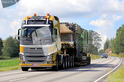 Image of Yellow Volvo FH16 Semi Hauls Oversize Load