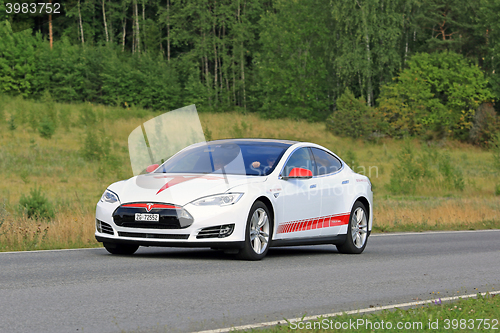 Image of Tesla Model S Unique Design Electric Car on Green Summer Road 