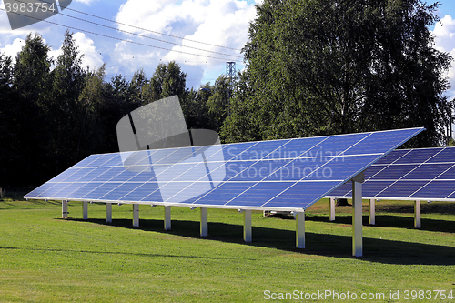 Image of Solar Panels on Green Grass Field