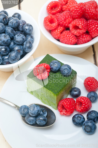 Image of green tea matcha mousse cake with berries